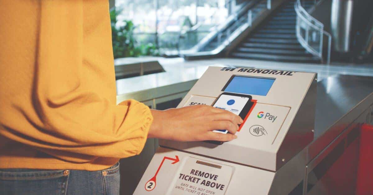 woman scanning mobile phone at Las Vegas Monorail ticket kiosk
