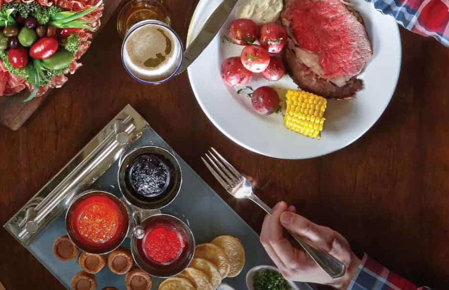 Food on table with hand holding fork