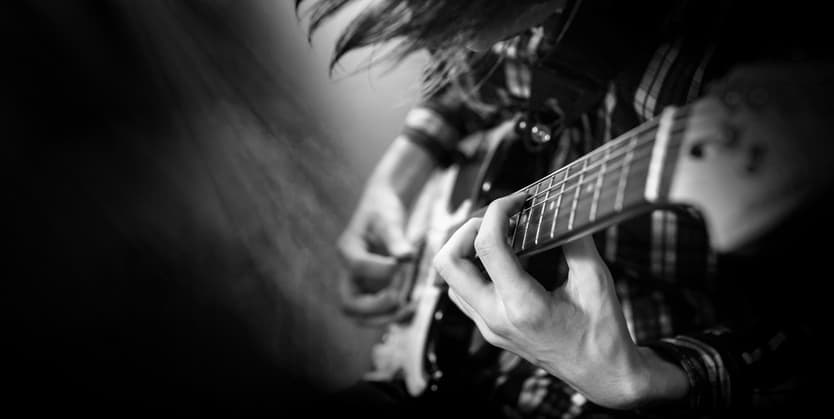 man playing electric guitar