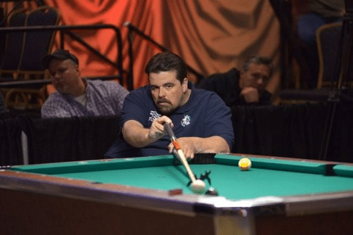 A pool player competing it the APA American Poolplayers Championships.